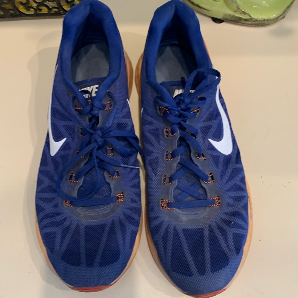 Men’s  11.5 Nike Running shoes. Used fair condition. Blue/Orange.